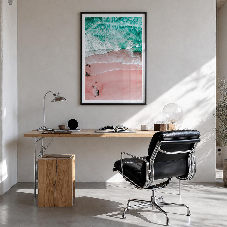 Pink Sandy Beach no. 1 colorful photo poster – vertical wall art in black wood frame with white border, hanging on wall