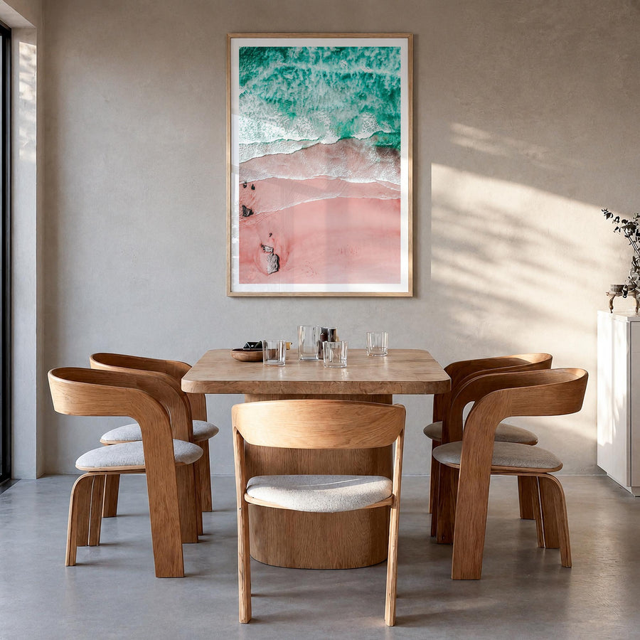 Pink Sandy Beach no. 1 colorful photo poster – vertical wall art in natural wood frame with white border, hanging on wall