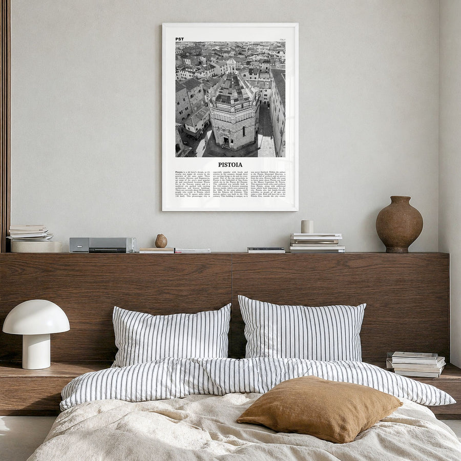 Pistoia Newspaper Poster in a white wood frame, hanging in a bedroom