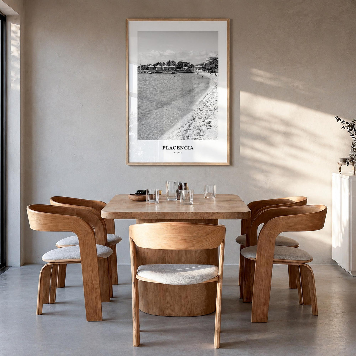 Placencia black & white classic poster of Belize – vertical wall art in natural wood frame, hanging on wall