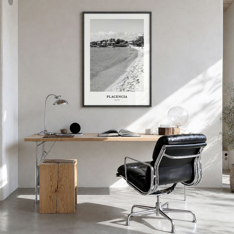 Placencia Classic Poster in a black wood frame, hanging in a bright home office