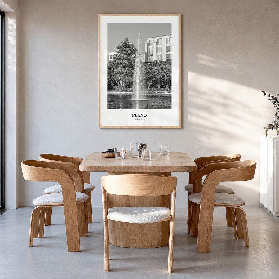 Plano Classic Poster in a natural wood frame, hanging in a dining room
