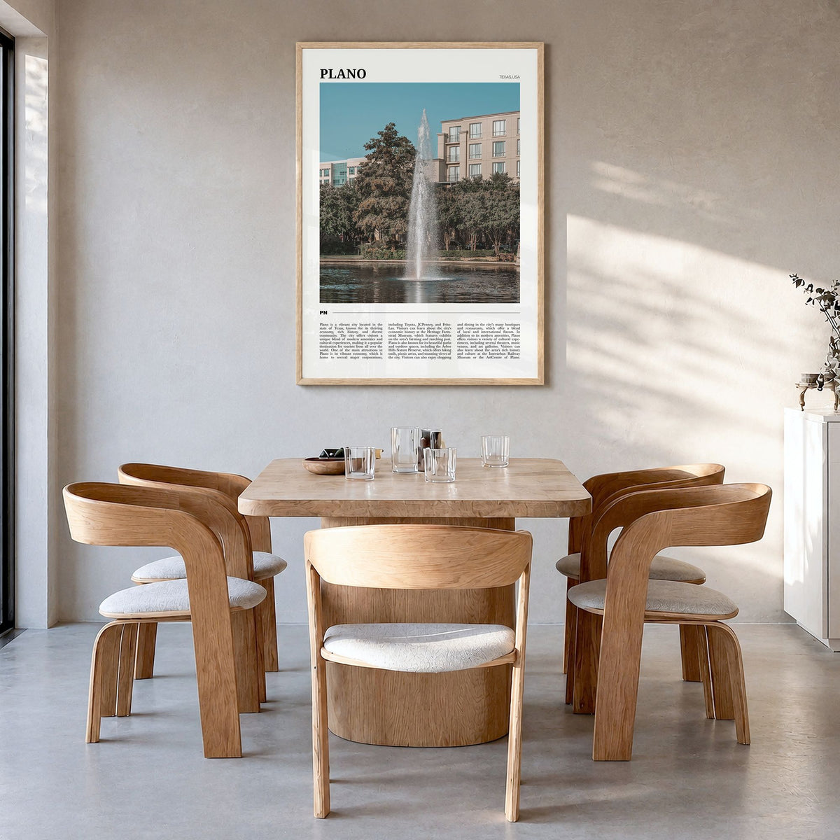 Plano Travel Poster in a natural wood frame, hanging in a dining room