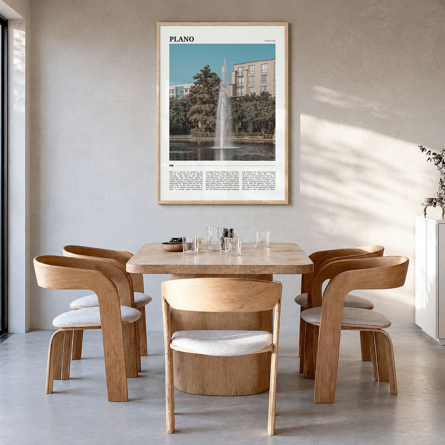 Plano Travel Poster in a natural wood frame, hanging in a dining room
