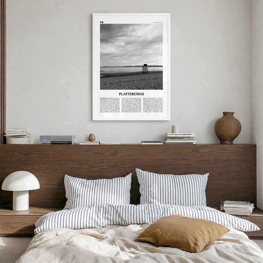 Plattsburgh Newspaper Poster in a white wood frame, hanging in a bedroom