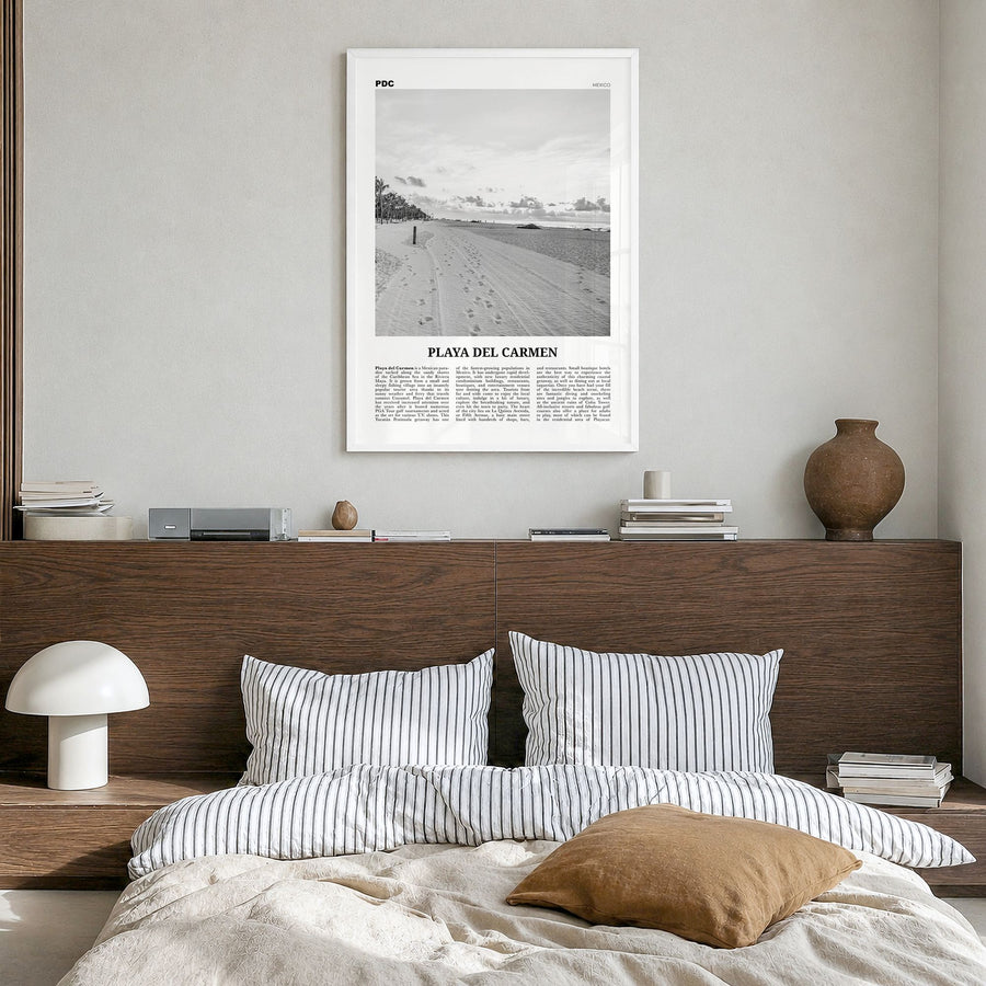 Playa del Carmen Newspaper Poster in a white wood frame, hanging in a bedroom