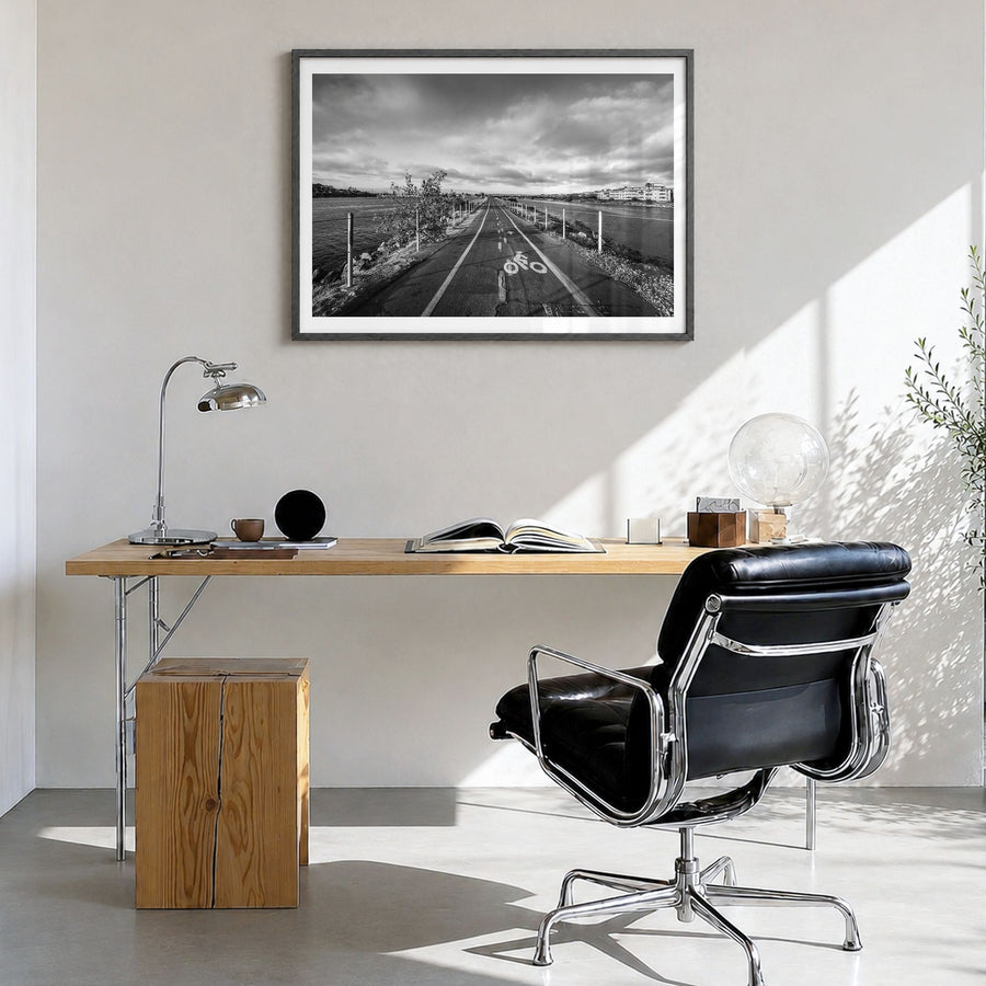 Playa del Rey Photo Poster in a black wood frame, hanging in a bright home office, white border