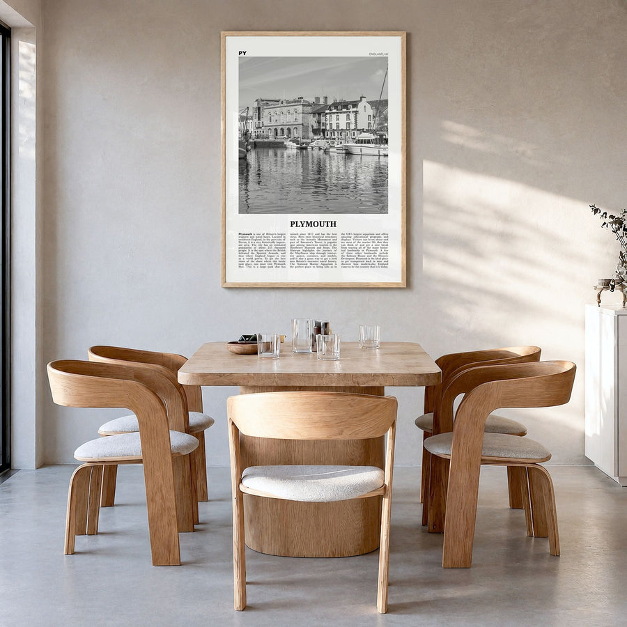 Plymouth Newspaper Poster in a natural wood frame, hanging in a dining room