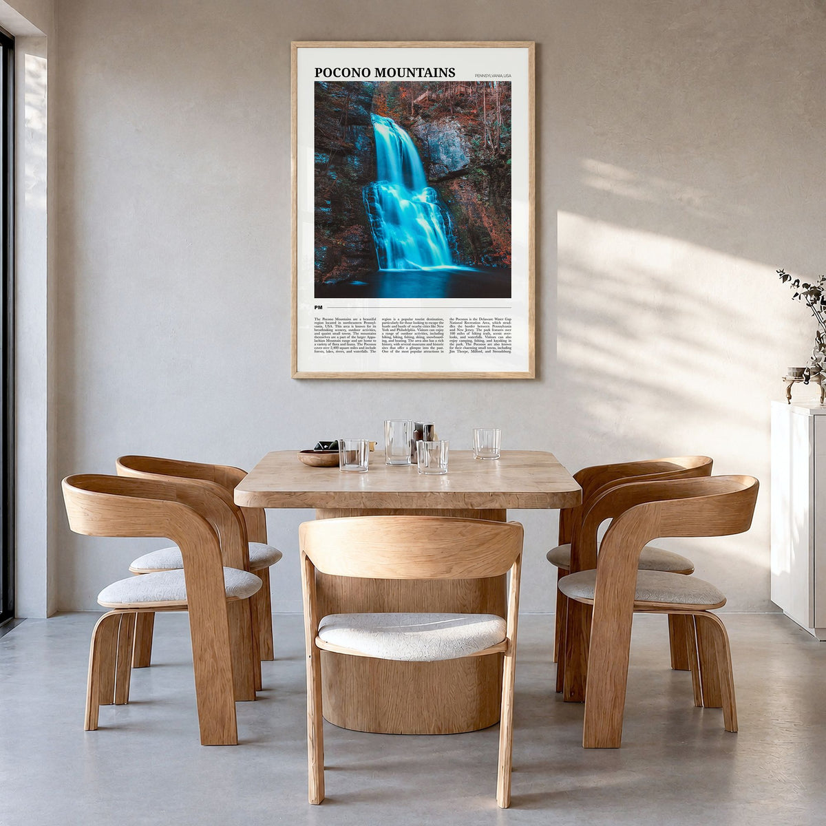 Pocono Mountains Travel No 1 Poster in a natural wood frame, hanging in a dining room