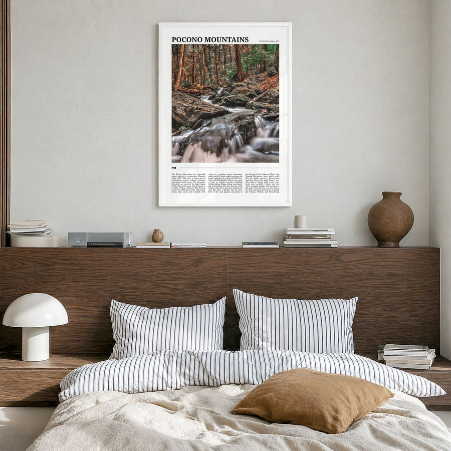Pocono Mountains Travel No 2 Poster in a white wood frame, hanging in a bedroom