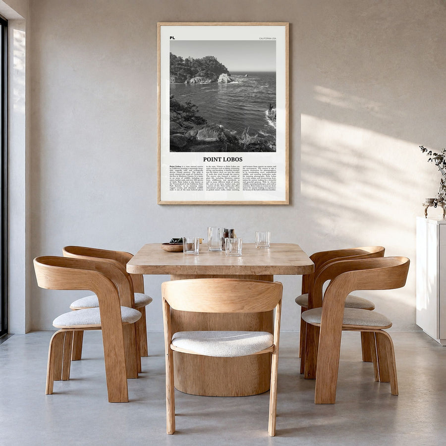 Point Lobos Newspaper Poster in a natural wood frame, hanging in a dining room
