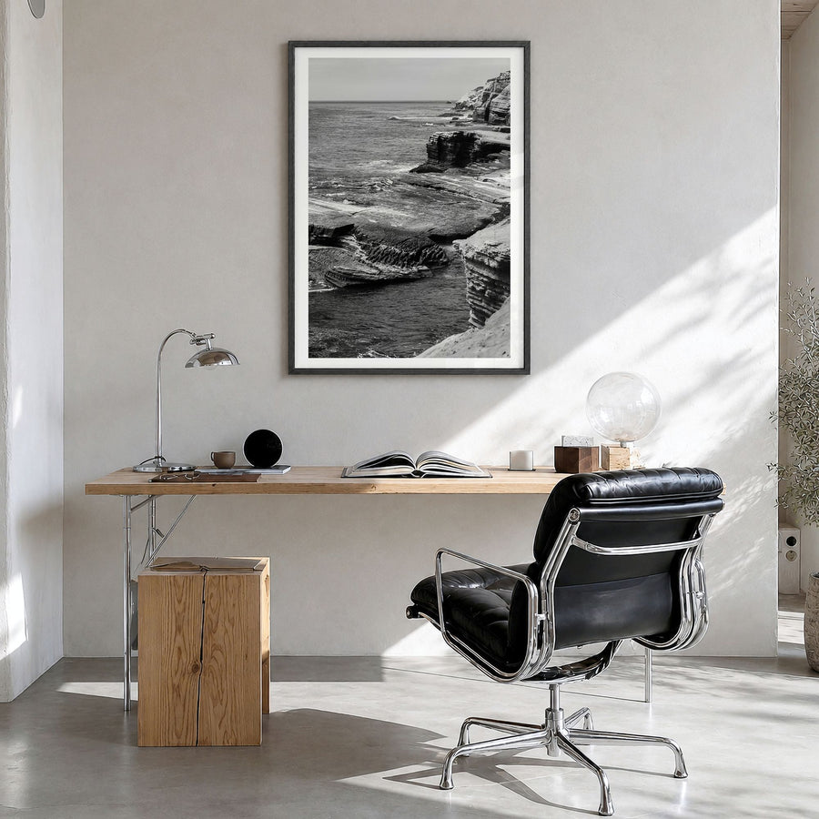 Point Loma Photo Poster in a black wood frame, hanging in a bright home office, white border