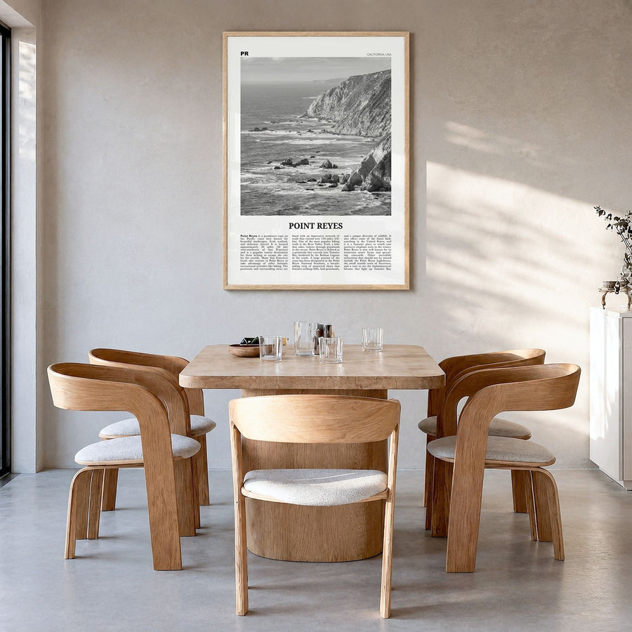 Point Reyes Newspaper Poster in a natural wood frame, hanging in a dining room