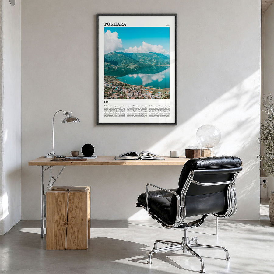 Pokhara Travel Poster in a black wood frame, hanging in a bright home office