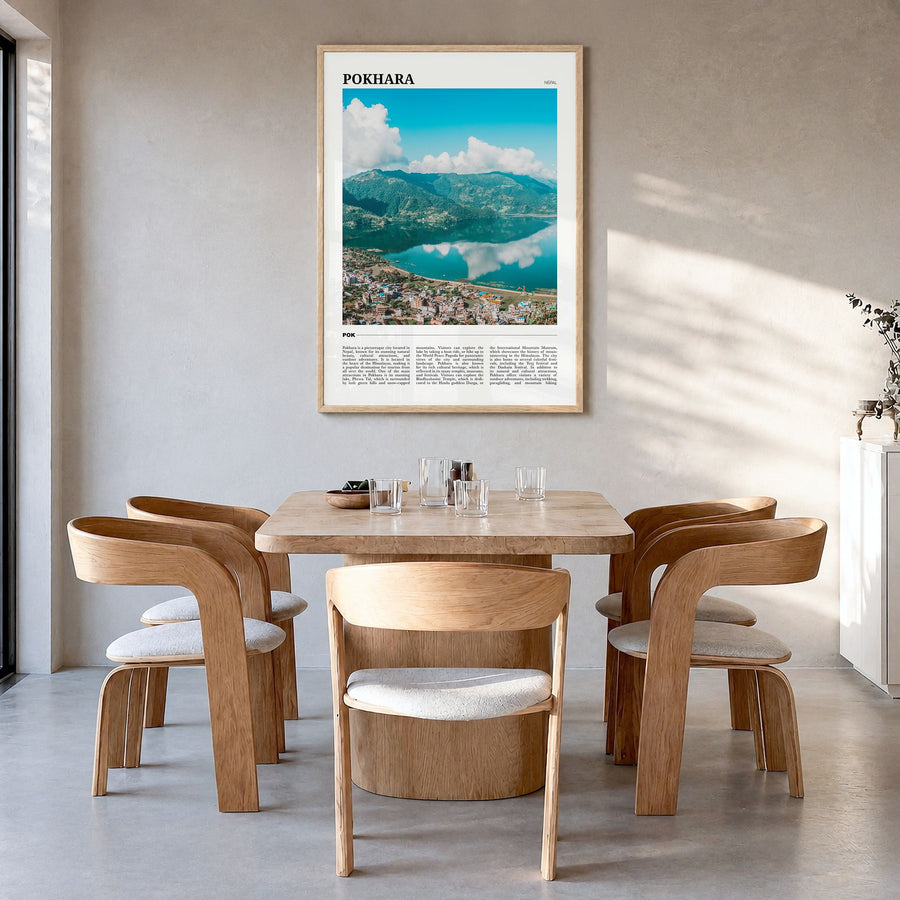 Pokhara Travel Poster in a natural wood frame, hanging in a dining room