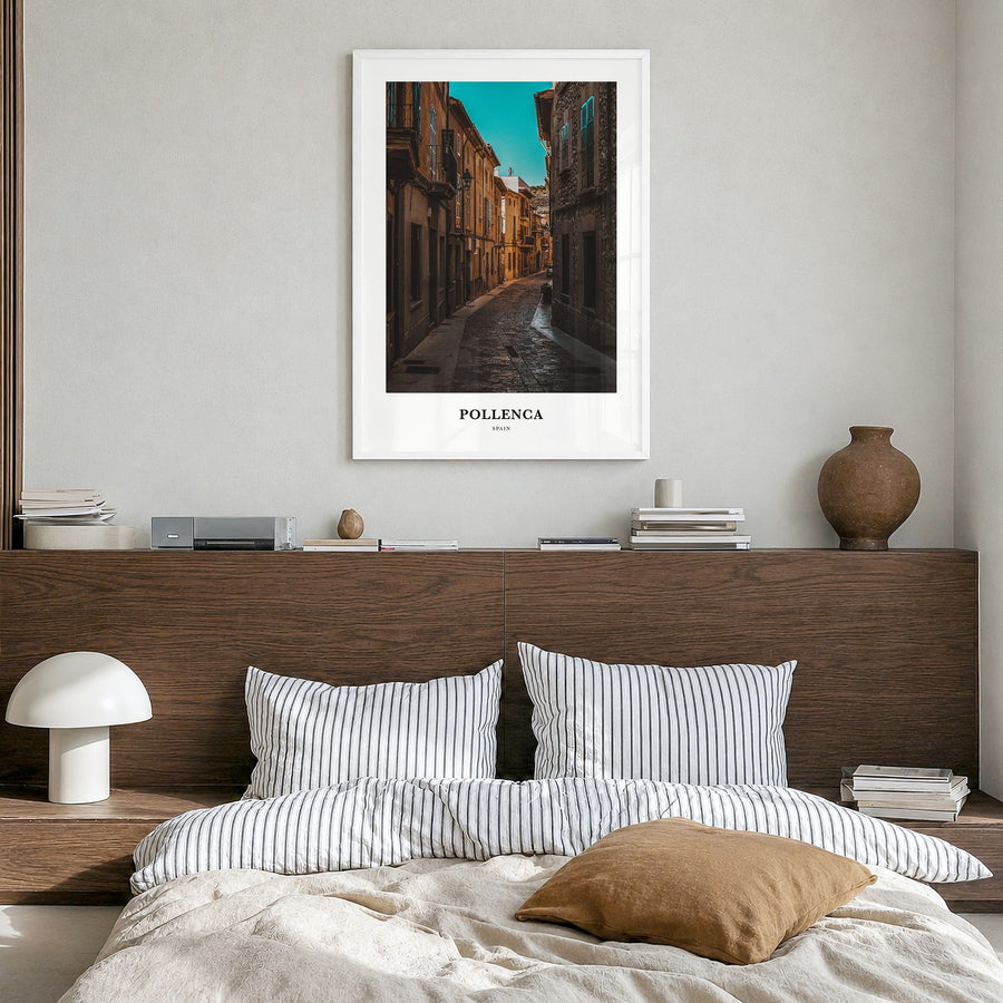 Pollença Classic Poster in a white wood frame, hanging in a bedroom