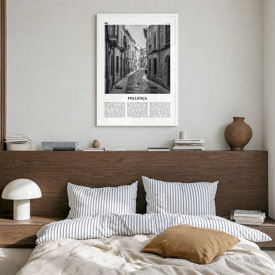 Pollença Newspaper Poster in a white wood frame, hanging in a bedroom