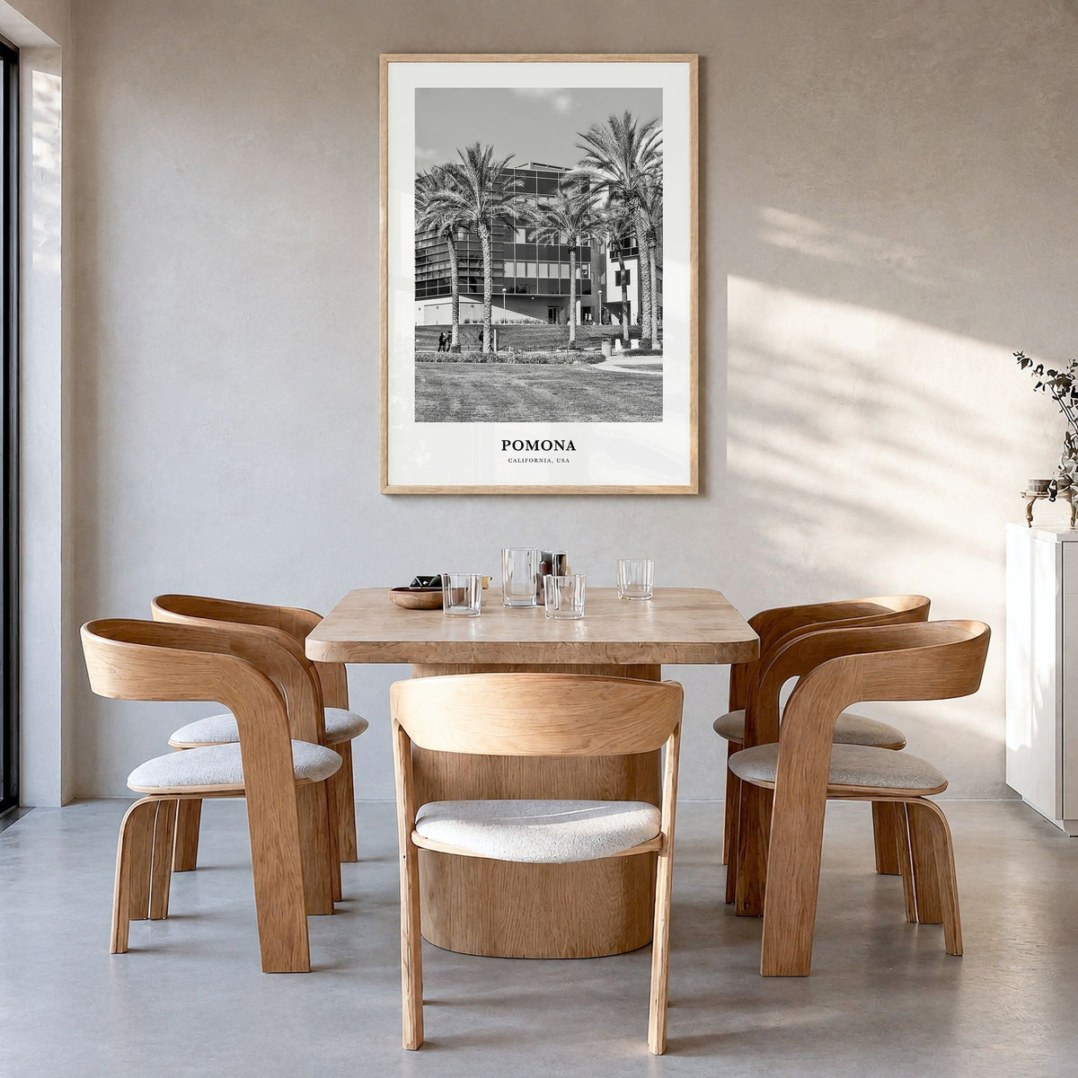 Pomona Classic Poster in a natural wood frame, hanging in a dining room