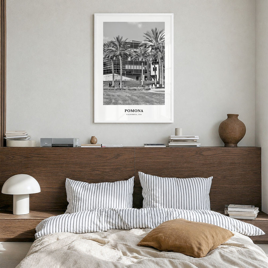 Pomona Classic Poster in a white wood frame, hanging in a bedroom