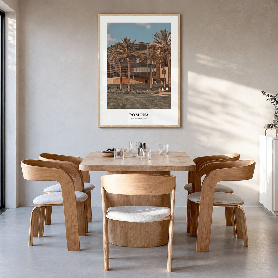 Pomona Classic Poster in a natural wood frame, hanging in a dining room