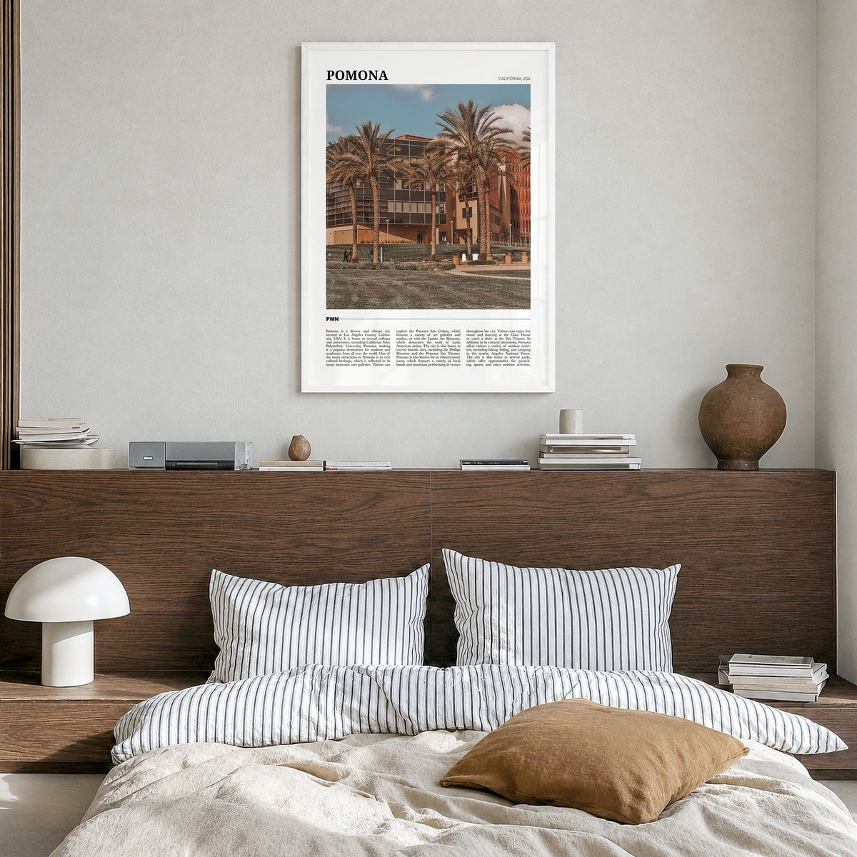 Pomona Travel Poster in a white wood frame, hanging in a bedroom