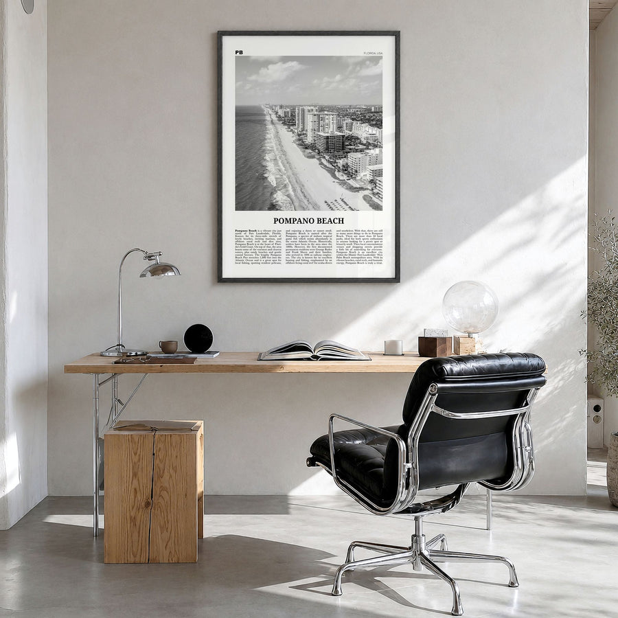 Pompano Beach Newspaper Poster in a black wood frame, hanging in a bright home office