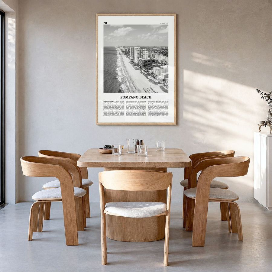 Pompano Beach Newspaper Poster in a natural wood frame, hanging in a dining room