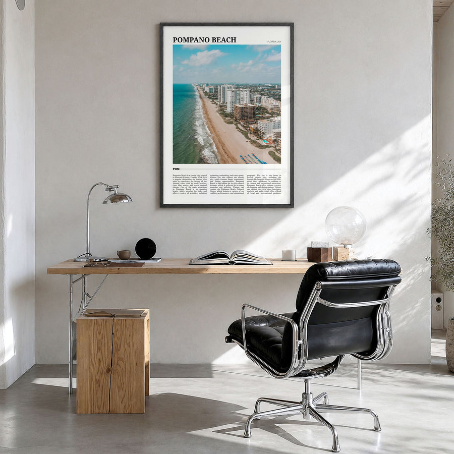 Pompano Beach Travel Poster in a black wood frame, hanging in a bright home office
