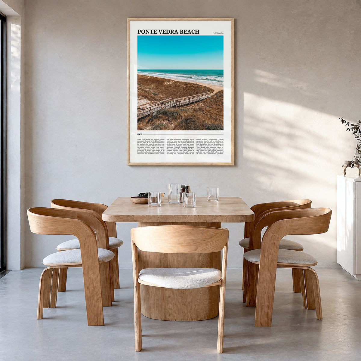 Ponte Vedra Beach Travel Poster in a natural wood frame, hanging in a dining room