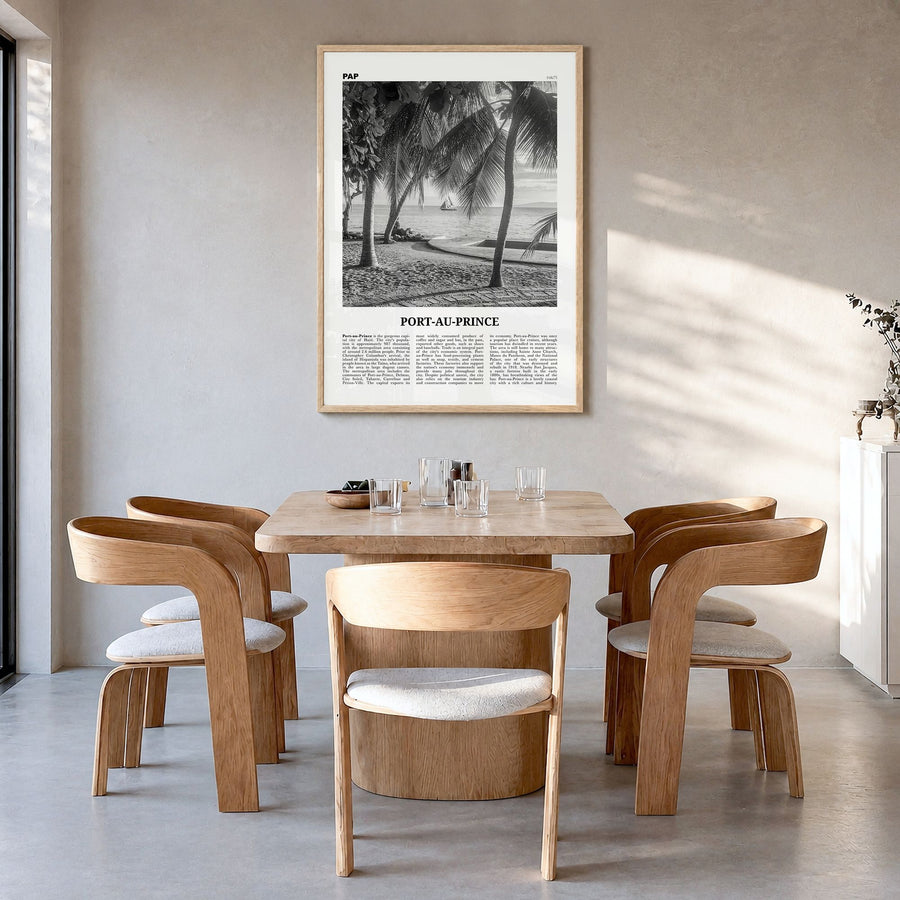 Port-au-Prince Newspaper Poster in a natural wood frame, hanging in a dining room