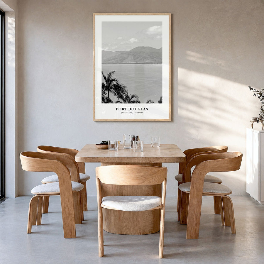 Port Douglas Classic Poster in a natural wood frame, hanging in a dining room
