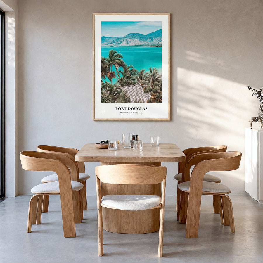 Port Douglas Classic Poster in a natural wood frame, hanging in a dining room