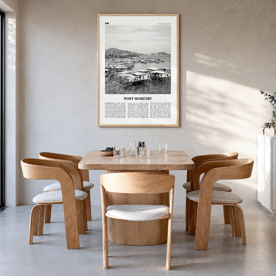 Port Moresby Newspaper Poster in a natural wood frame, hanging in a dining room