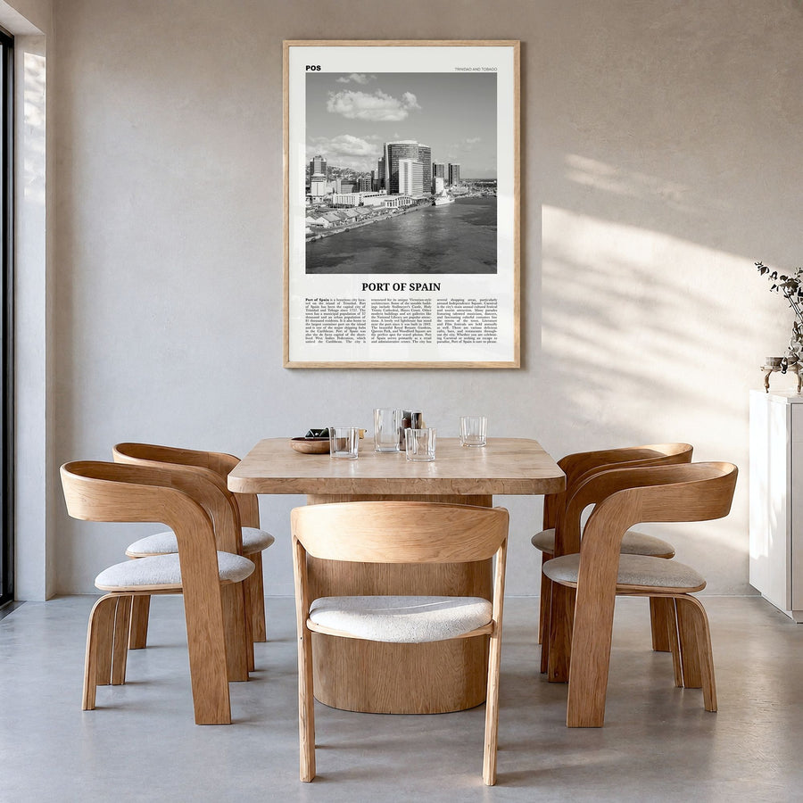 Port of Spain Newspaper Poster in a natural wood frame, hanging in a dining room