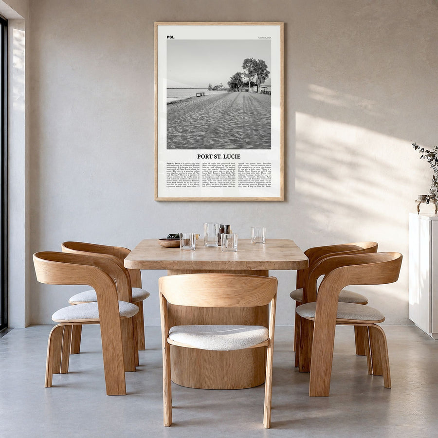 Port St. Lucie Newspaper Poster in a natural wood frame, hanging in a dining room