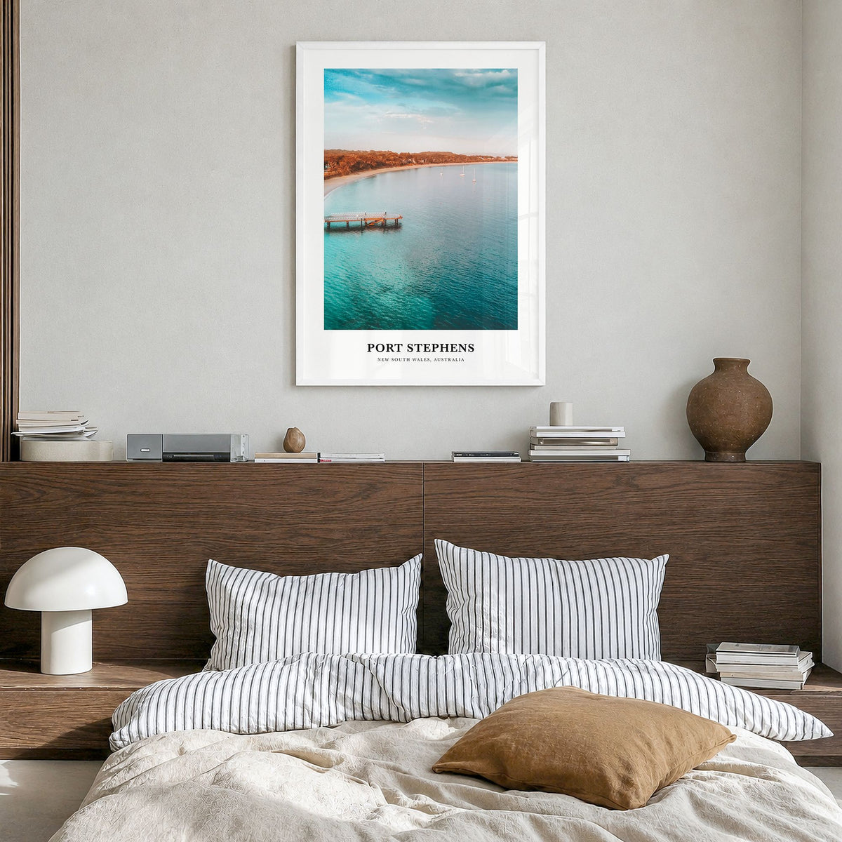 Port Stephens Classic Poster in a white wood frame, hanging in a bedroom