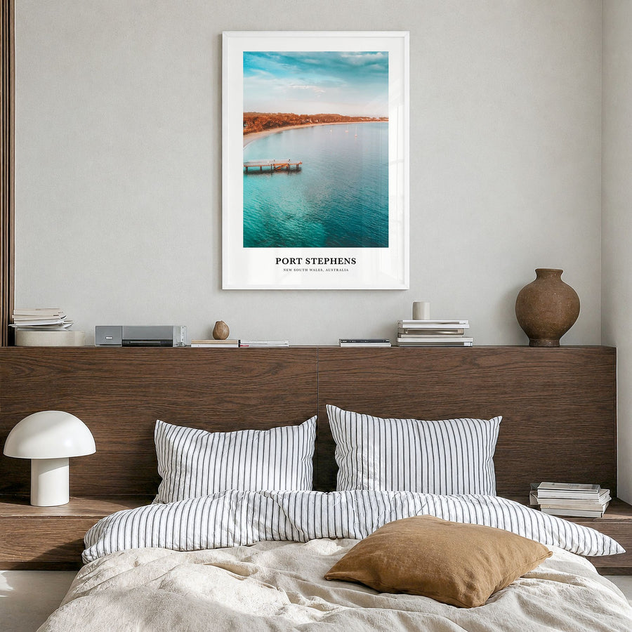 Port Stephens Classic Poster in a white wood frame, hanging in a bedroom