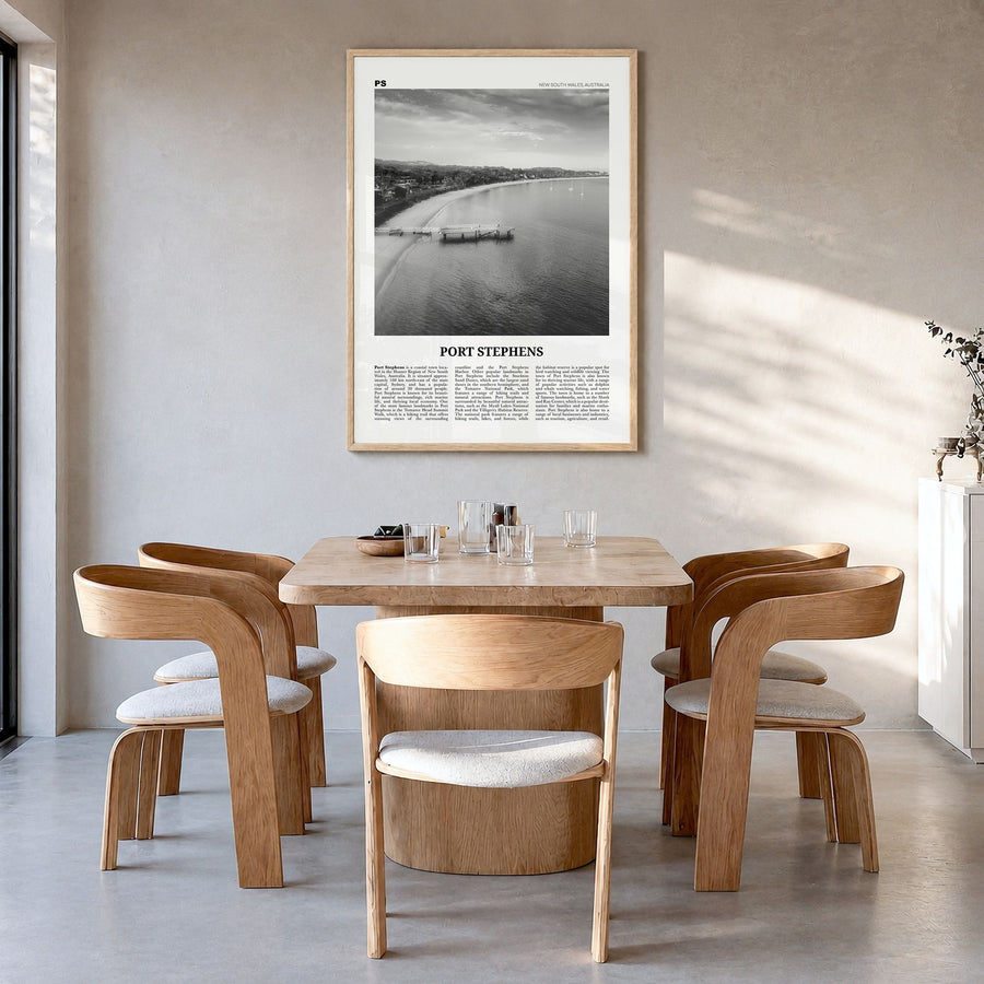 Port Stephens Newspaper Poster in a natural wood frame, hanging in a dining room