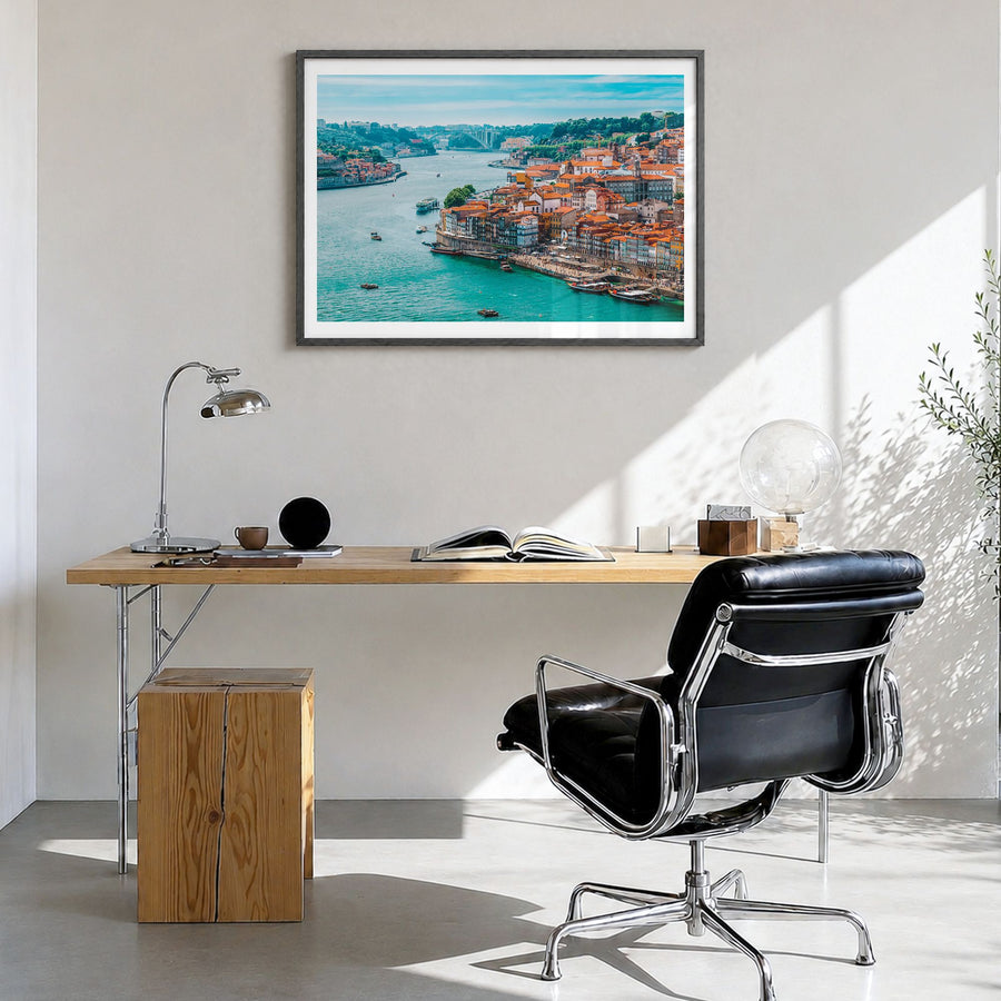 Portugal Photo Poster in a black wood frame, hanging in a bright home office, white border