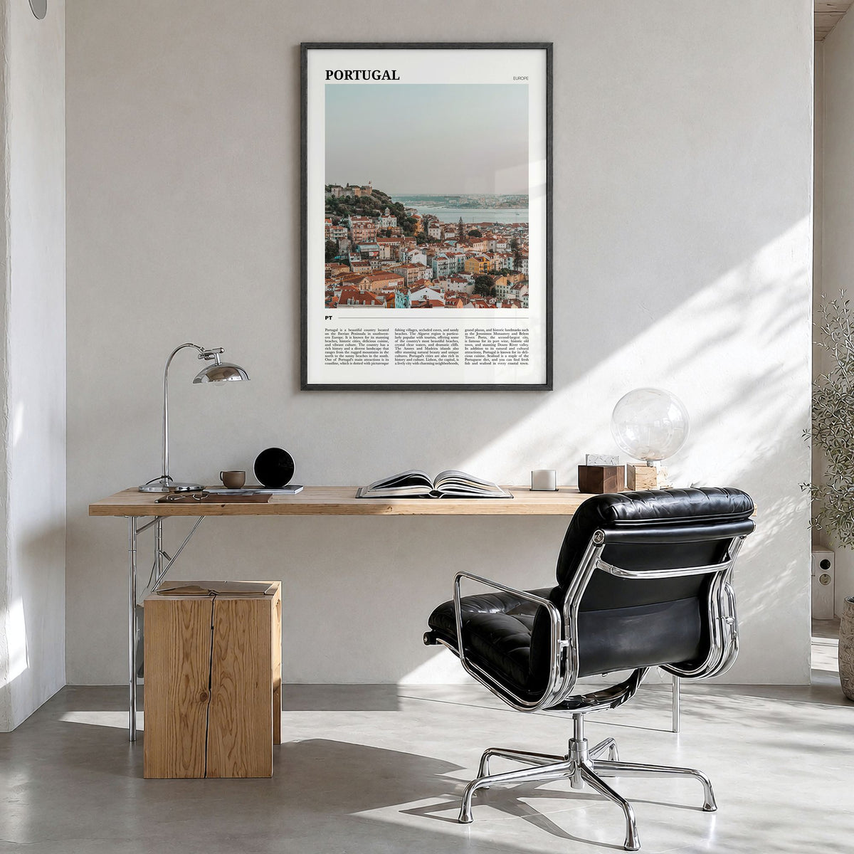 Portugal Travel Poster in a black wood frame, hanging in a bright home office