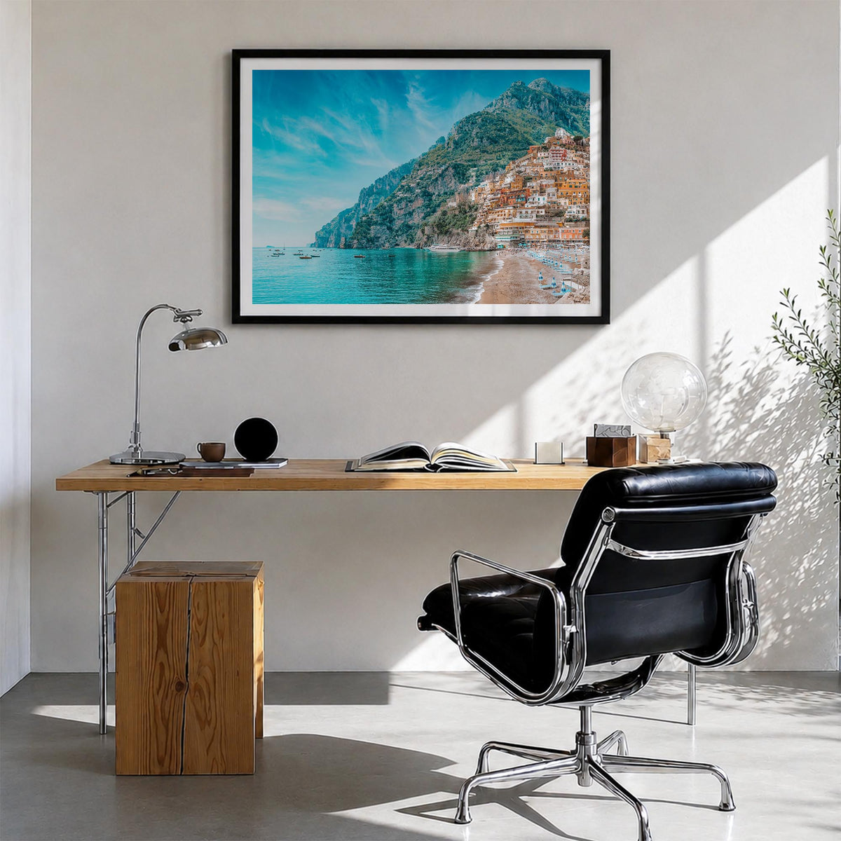 Positano colorful photo poster of Italy – horizontal wall art in black wood frame with white border, hanging on wall