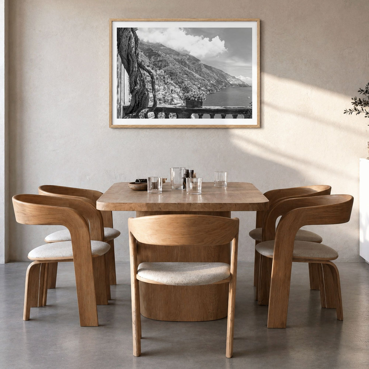 Positano Photo No 1 Poster in a natural wood frame, hanging in a dining room, white border