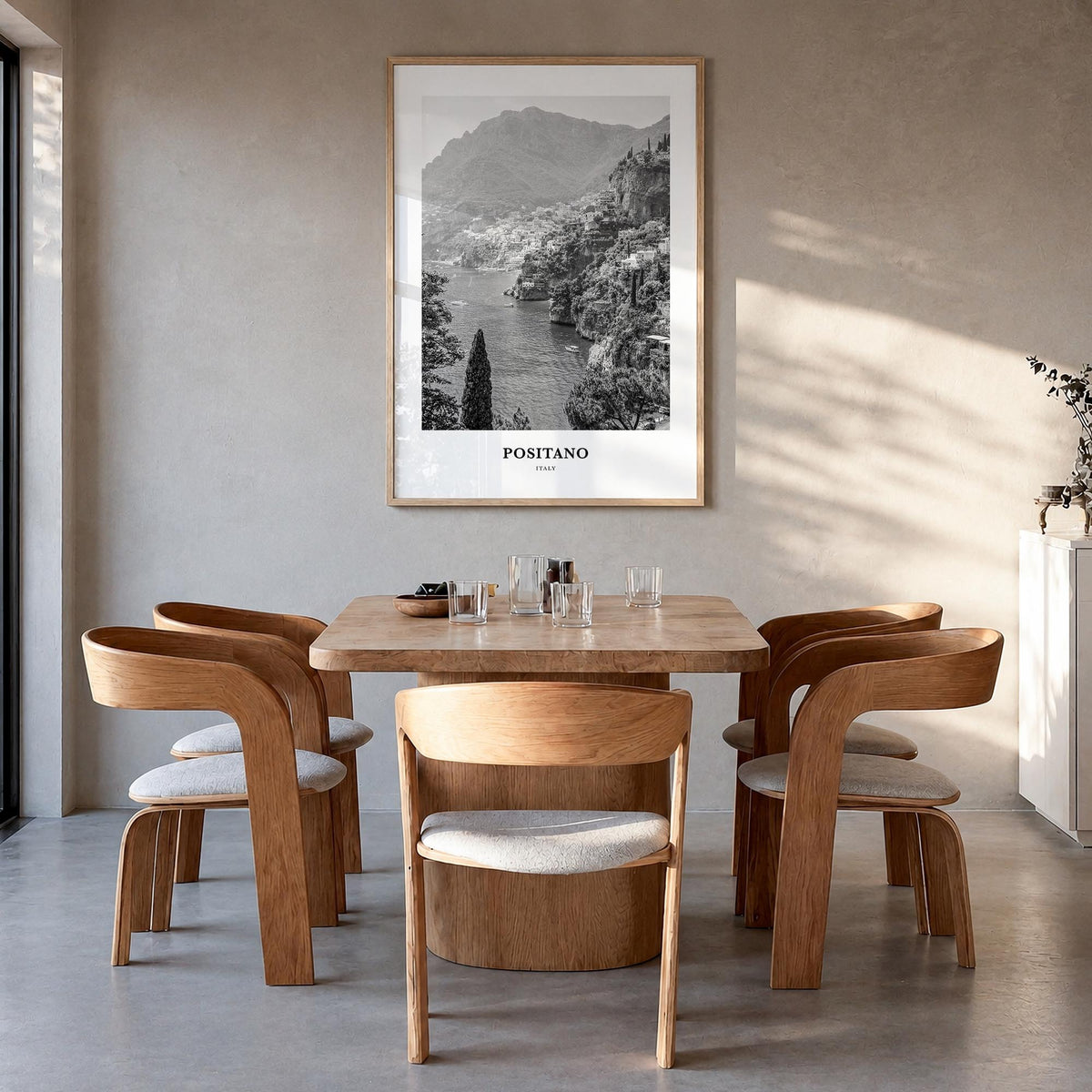 Positano no. 1 black & white classic poster of Italy – vertical wall art in natural wood frame, hanging on wall