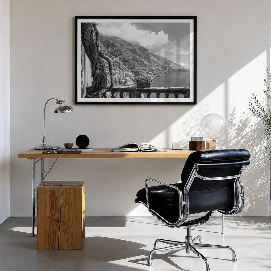 Positano no. 1 black & white photo poster of Italy – horizontal wall art in black wood frame with white border, hanging on wa