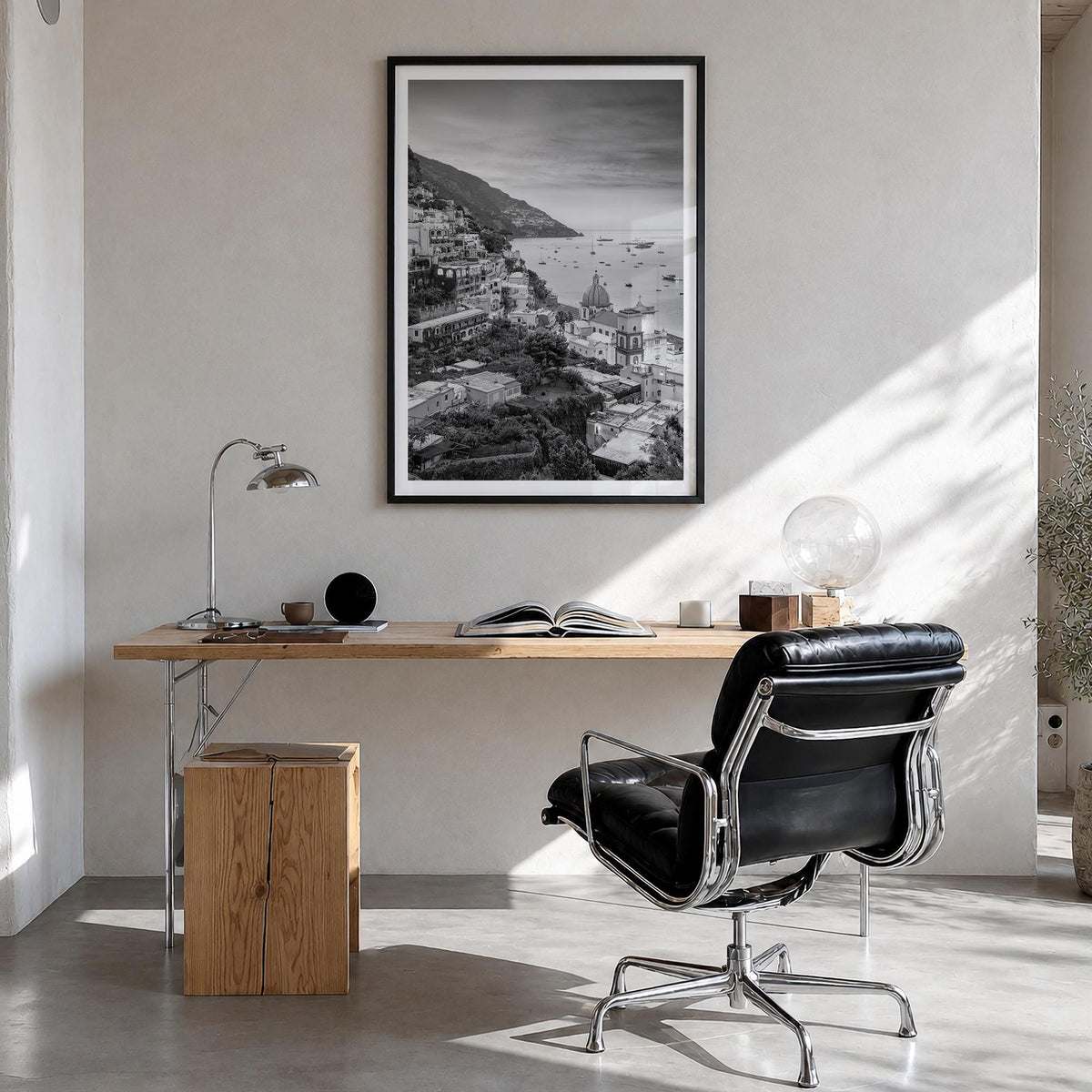 Positano no. 1 black & white photo poster of Italy – vertical wall art in black wood frame with white border, hanging on wall