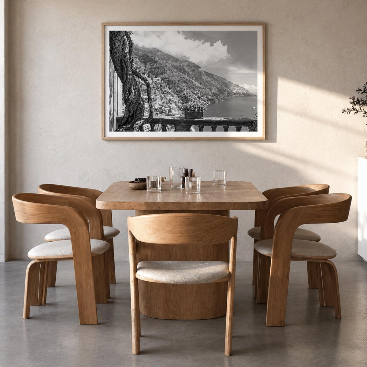 Positano no. 1 black & white photo poster of Italy – horizontal wall art in natural wood frame with white border, hanging on 