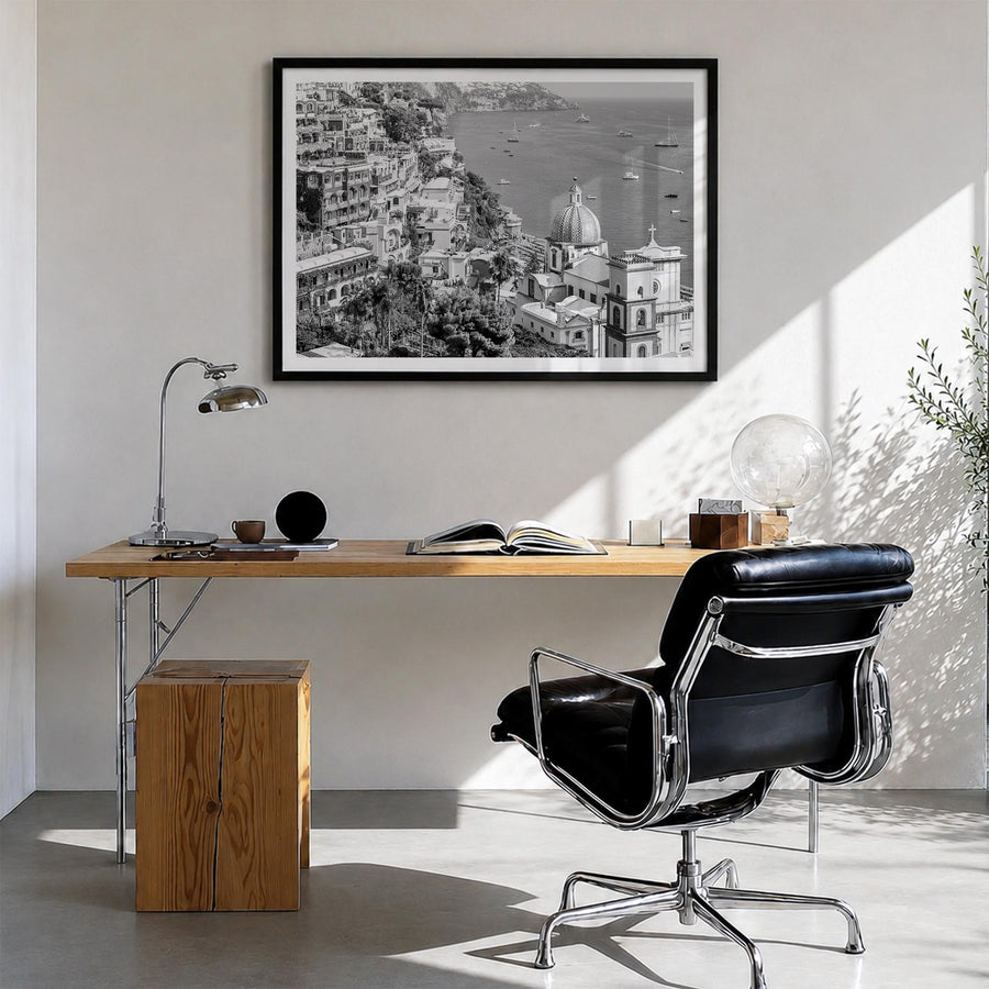 Positano no. 2 black & white photo poster of Italy – horizontal wall art in black wood frame with white border, hanging on wa