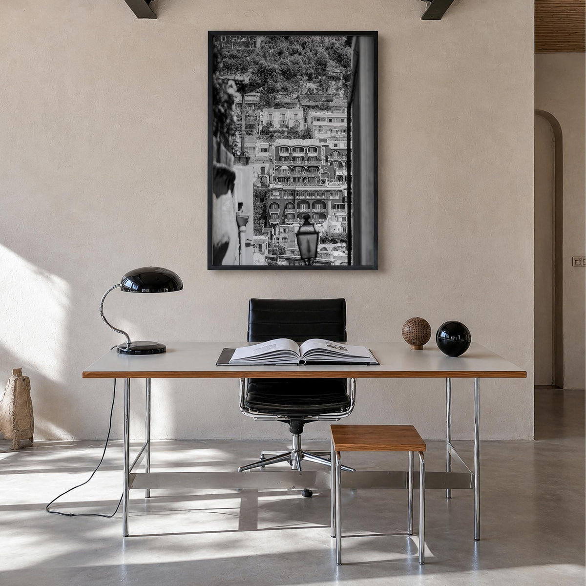 Positano no. 2 black & white photo poster of Italy – vertical wall art in black wood frame, hanging on wall