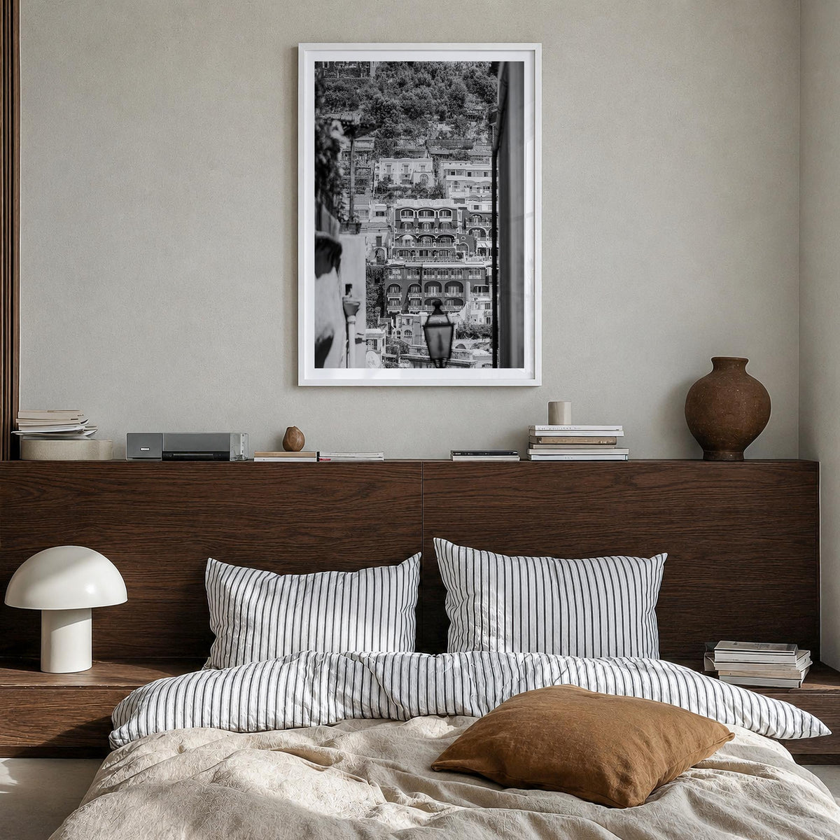 Positano no. 2 black & white photo poster of Italy – vertical wall art in white wood frame with white border, hanging on wall