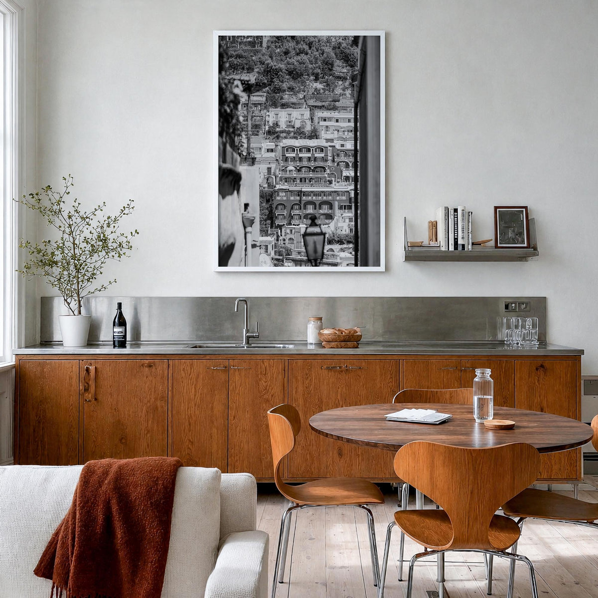 Positano no. 2 black & white photo poster of Italy – vertical wall art in white wood frame, hanging on wall